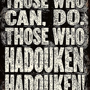 May include: Black and white poster with the text "THOSE WHO CAN, DO. THOSE WHO HADOUKEN HADOUKEN!" in a distressed, textured font. The design has a vintage, grunge aesthetic.