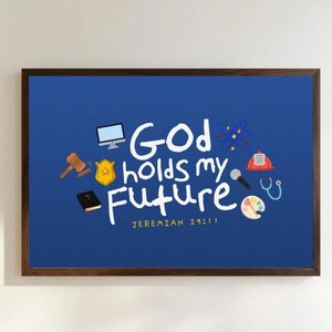 May include: A rectangular wall art piece in a dark wood frame featuring a blue background with the white text "God holds my future" and "JEREMIAH 29:11". Surrounding the text are small icons including a computer, gavel, badge, book, atom, helmet, microphone, stethoscope, and paint palette.