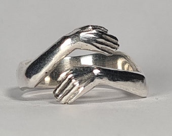 Small Sterling Silver Hug Ring: Handmade in London from recycled solid 925 sterling. Friendship Christmas Gift