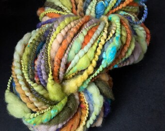 hand spun Art Yarn Super Coils Sunset over Fields Merino and Cotton.