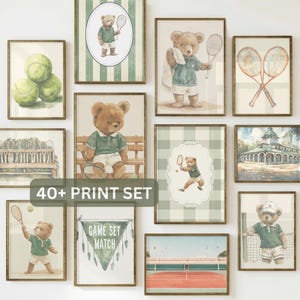 May include: A collection of twelve framed wall art prints featuring tennis-themed illustrations of teddy bears, tennis rackets, balls, and a court. The set includes a banner with the text GAME SET MATCH and a label reading 40+ PRINT SET.