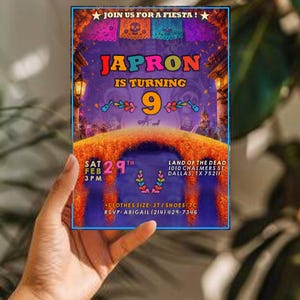 May include: A rectangular birthday invitation card featuring a vibrant purple and orange theme with marigold petals, skull banners, and the text: JOIN US FOR A FIESTA! JAPRON IS TURNING 9, SAT FEB 29TH 3 PM, LAND OF THE DEAD 1010 CHALMERS ST DALLAS, TX 75211.