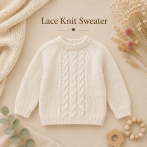 May include: An off-white long-sleeve sweater featuring a central vertical cable knit pattern, a ribbed crew neckline, and ribbed cuffs. The text "Lace Knit Sweater" is printed above the garment in a dark brown serif font with a small heart icon.