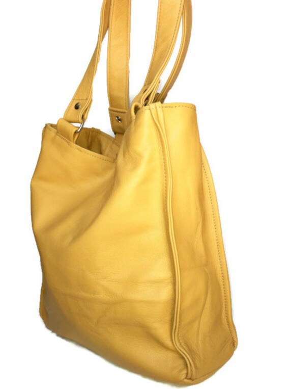 cream over shoulder bag