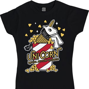 May include: Black t-shirt with a white unicorn inside a red and white striped popcorn bucket. The unicorn has a yellow mane and tail. The text "Unicorn Magical Buttery Goodness" is printed below the bucket.