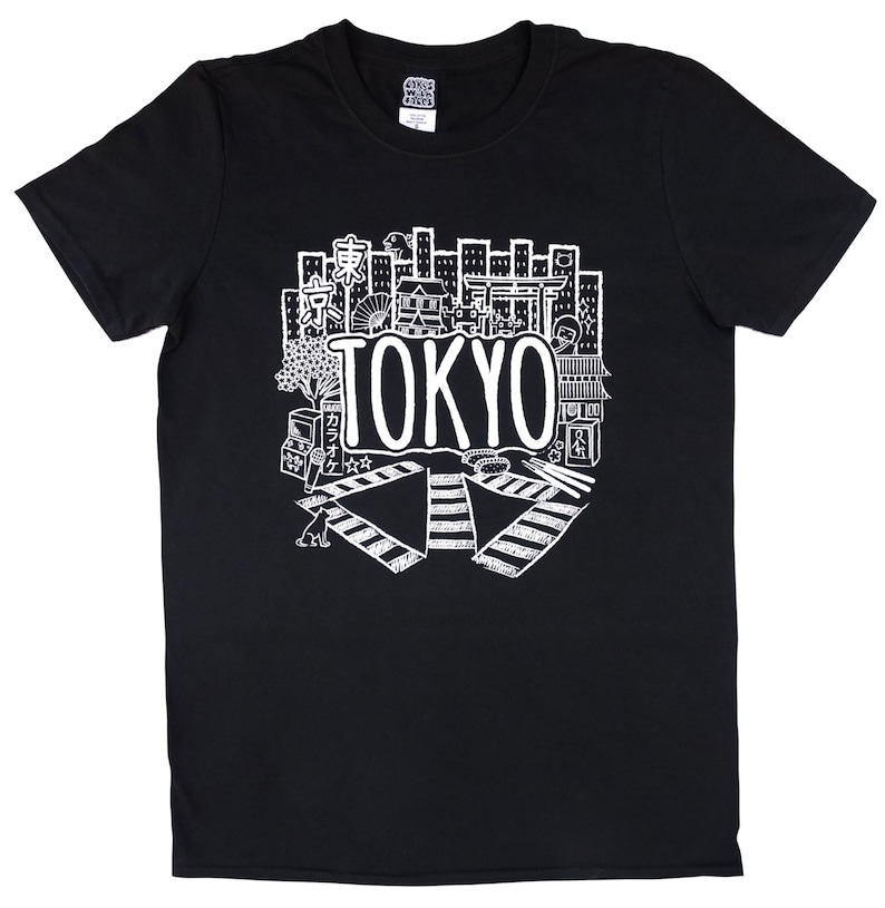 May include: Black t-shirt with a white graphic design of a cityscape with the word "TOKYO" in large letters. The design includes various Japanese symbols and icons.