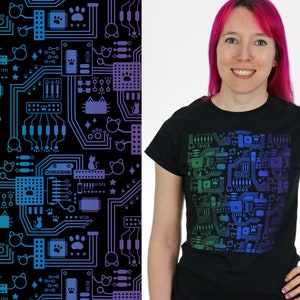 May include: A black t-shirt featuring a colourful design of a circuit board with cats and paw prints. The design is a gradient of green, blue and purple.