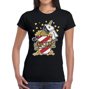 May include: Black t-shirt with a graphic of a unicorn in a popcorn bucket. The text "Unicorn Magical Buttery Goodness" is printed below the graphic.