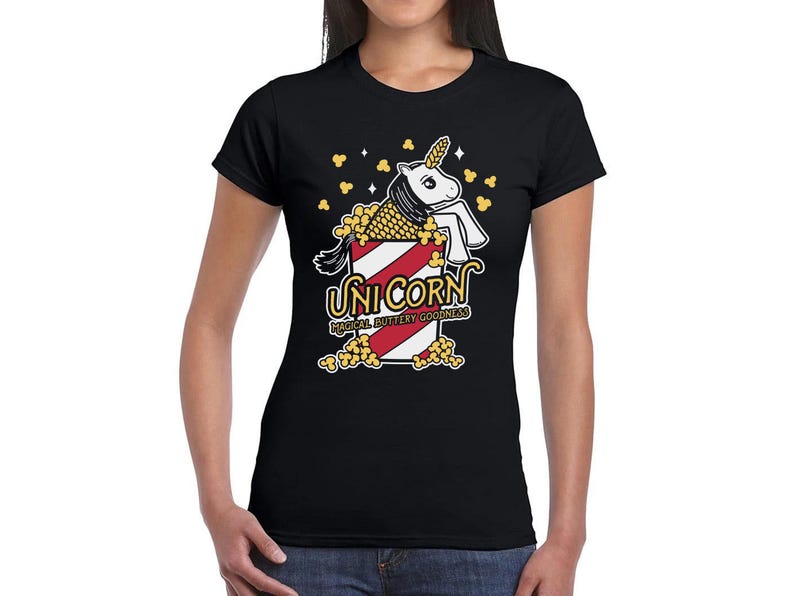 May include: Black t-shirt with a graphic of a unicorn in a popcorn bucket. The text "Unicorn Magical Buttery Goodness" is printed below the graphic.