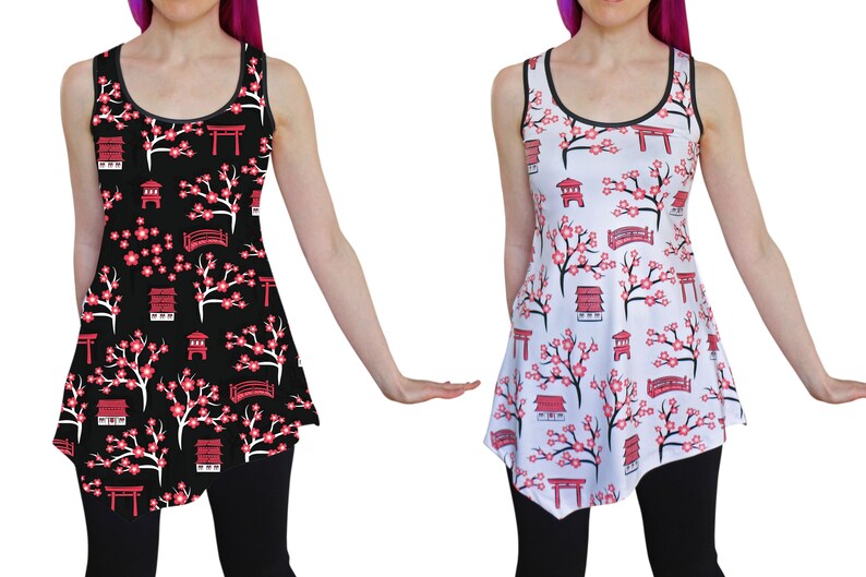 May include: Two sleeveless dresses with a Japanese cherry blossom and temple print. One dress is black with white flowers and the other is white with pink flowers.