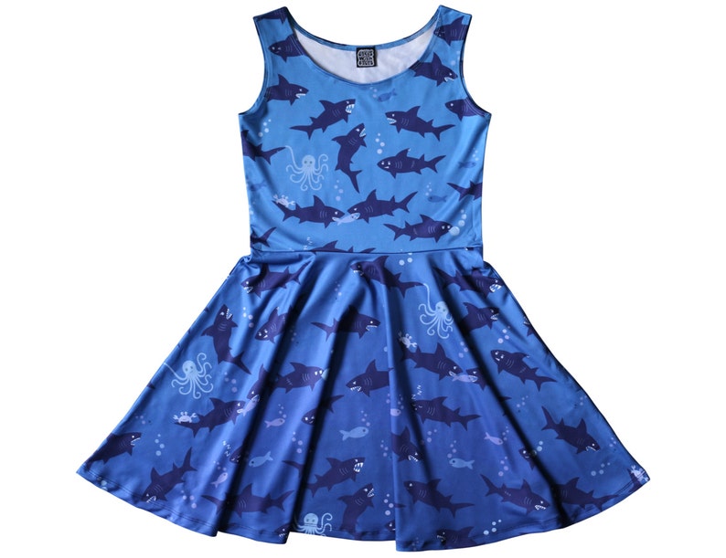 Sleeveless skater dress (just above knee length) in blue with a pattern of sharks.