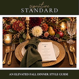 May include: A place setting featuring a gold charger plate, a white plate, and a dark green linen napkin. A menu card is placed on the plate. Gold flatware, a crystal glass, and a votive candle are arranged on a dark wooden table.