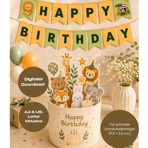 May include: A Happy Birthday banner with yellow and green pennants featuring animal illustrations, and a cylindrical gift box decorated with a cake graphic, text, and animal cutouts including a giraffe, bear, fox, rabbit, lion, and elephant.