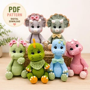 May include: Six crocheted dinosaur dolls in various colors including gray, green, blue, and pink. The dolls feature large black eyes, small horns, and decorative bows or neckties. A circular badge in the top left corner reads PDF PATTERN DIGITAL DOWNLOAD.