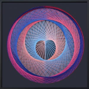 May include: A circular string art piece featuring concentric layers of thread in shades of pink, light blue, and dark blue. The threads are arranged in a geometric pattern that creates a central heart-shaped negative space, all encased in a black frame.
