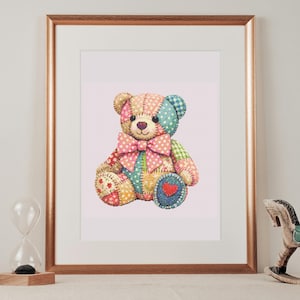 May include: A framed print featuring a patchwork teddy bear with a light pink background. The bear is composed of various fabric patterns in shades of pink, blue, yellow, and green, accented by a large pink polka-dot bow and a small red heart.