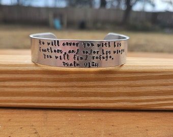 He will cover you with feathers and under his wings... - Psalms 91:4 metal stamped Bible verse cuff bracelet - 5/8 inches wide - aluminum