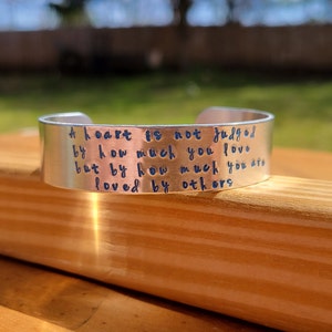 The Wizard of Oz - &quot;A Heart is Not Judged By How Much You Love...&quot; metal stamped literary quote necklace - Baum