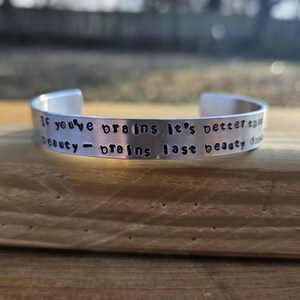 Emily of New Moon metal stamped quote cuff bracelet -&quot;If you&#39;ve brains it&#39;s better than beauty - brains last beauty doesn&#39;t&quot; - LM Montgomery