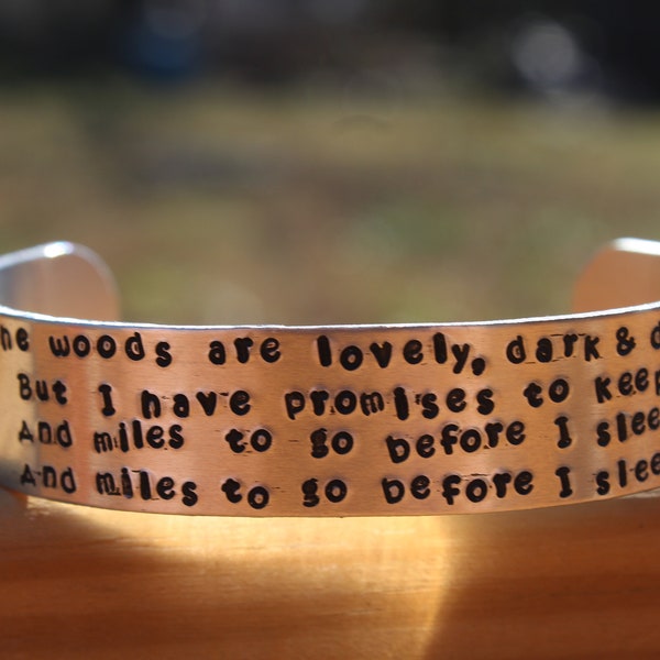 Robert Frost - Stopping By the Woods on a Snowy Evening - The woods are lovely, dark and deep, - 5/8 inch wide metal stamped quote bracelet