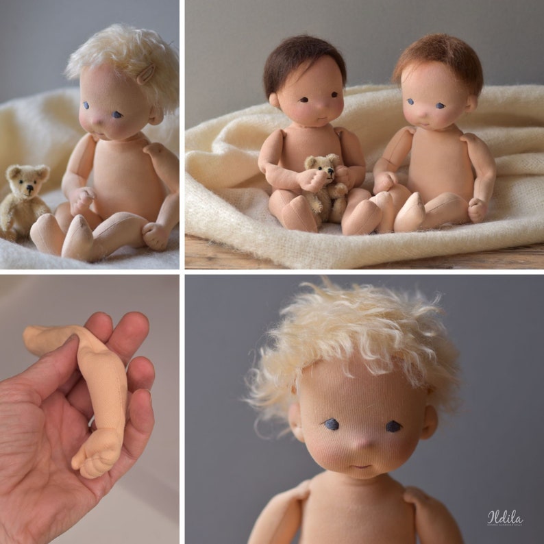 May include: Three handmade cloth dolls with blonde and brown hair. The dolls are sitting on a white blanket. One doll is holding a small teddy bear.
