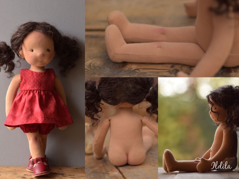 May include: A handmade doll with brown hair and a red dress. The doll is sitting on a wooden surface.