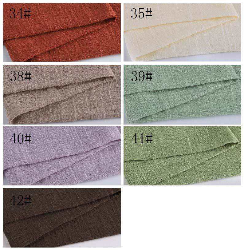 May include: A collection of seven fabric swatches featuring a textured, woven appearance. The colors include rust, cream, beige, light green, lavender, olive green, and dark brown. Each swatch is labeled with a number from 34# to 42#.