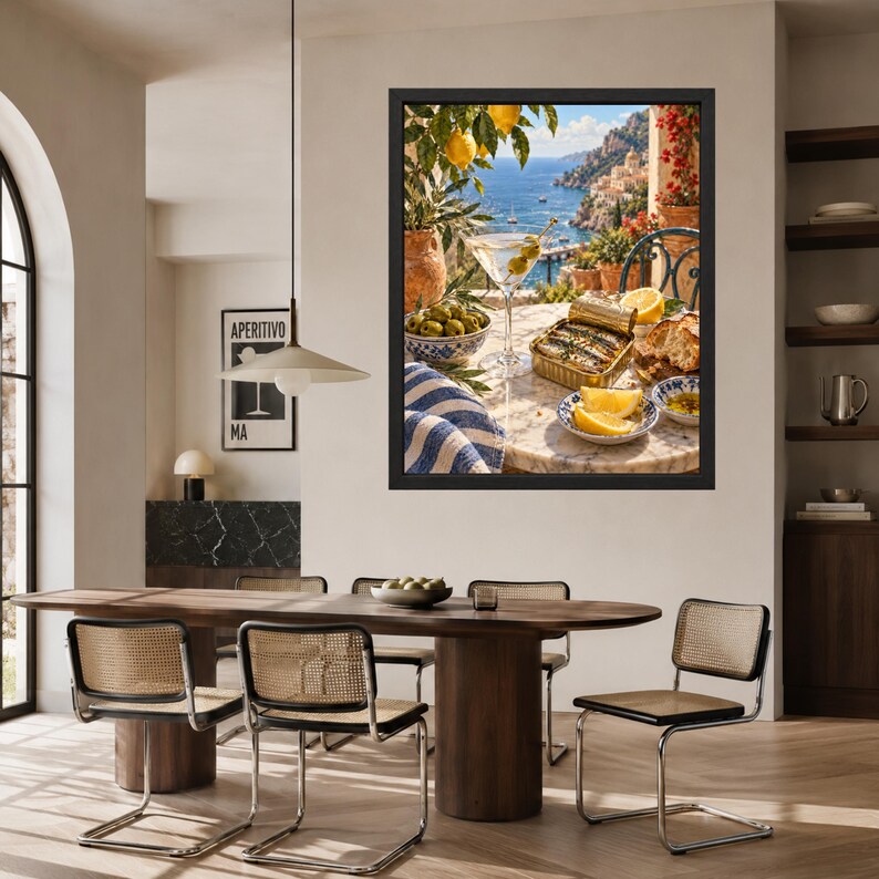 May include: A framed wall art print depicting a Mediterranean coastal scene with a martini, a tin of sardines, lemon wedges, and olives on a marble table. The artwork features a vibrant blue sea, rocky cliffs, and lush greenery in the background.