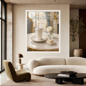 May include: A framed wall art print featuring a white paper cup resting on a porcelain saucer, accompanied by a small cake and a white flower in a glass vase. The text "PAPER CUP, PORCELAIN SAUCER" is printed in elegant gold and blue lettering above.