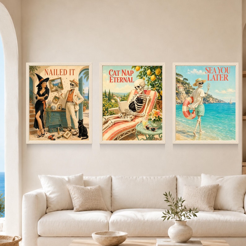 May include: Three framed wall art prints featuring skeleton illustrations. The left print shows a witch and a skeleton with the text NAILED IT. The center print shows a skeleton lounging with the text CAT NAP ETERNAL. The right print shows a skeleton at the beach with the text SEA YOU LATER.