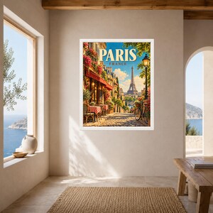 May include: A framed wall art print depicting a Parisian street scene with a cafe, red awnings, a bicycle, and the Eiffel Tower in the distance. The text PARIS FRANCE is printed in large, bold, cream-colored letters at the top of the artwork.