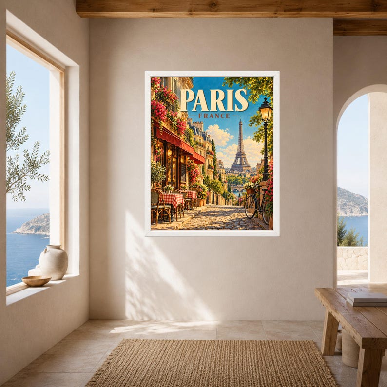 May include: A framed wall art print depicting a Parisian street scene with a cafe, red awnings, a bicycle, and the Eiffel Tower in the distance. The text PARIS FRANCE is printed in large, bold, cream-colored letters at the top of the artwork.