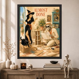 May include: A framed wall art print titled ALMOST DONE featuring a witch in a black dress and hat standing next to a skeleton wearing a hat and sunglasses who is reading assembly instructions for a wooden furniture piece with a black cat nearby.