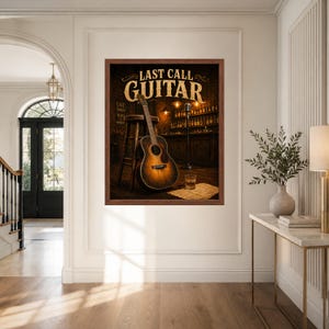 May include: A framed wall art print featuring an acoustic guitar leaning against a wooden stool in a dimly lit bar setting. The text LAST CALL GUITAR is displayed at the top. A microphone stand and a glass of amber liquid are visible nearby.
