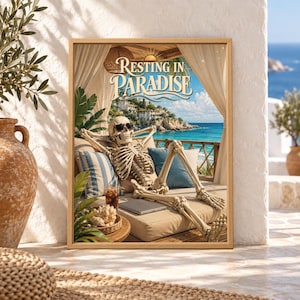 Framed Resting in Paradise skeleton wall art showing a skeleton in sunglasses relaxing on a coastal daybed beside a drink and laptop overlooking a bright turquoise Mediterranean sea.