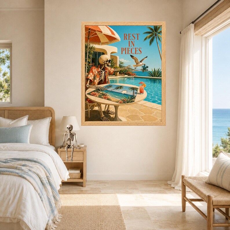 May include: A framed wall art print featuring a skeleton wearing a floral shirt sitting at a patio table by a swimming pool. The text REST IN PIECES is printed above. A seagull flies nearby, and a cocktail sits on the table under a striped umbrella.