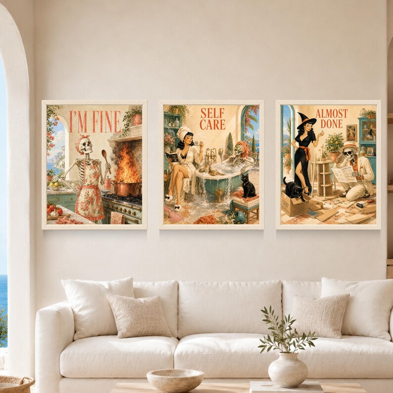 May include: Three framed wall art prints featuring retro-style illustrations. The left print shows a skeleton in an apron with the text I'M FINE. The center print depicts a person and a skeleton in a bathroom with the text SELF CARE. The right print shows a witch and a skeleton with the text ALMOST DONE.
