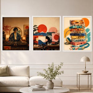 May include: Three framed wall art prints featuring musical themes. The left print shows a person DJing with turntables. The center print depicts a vinyl record player with a mountain landscape. The right print displays a stack of colorful cassette tapes.