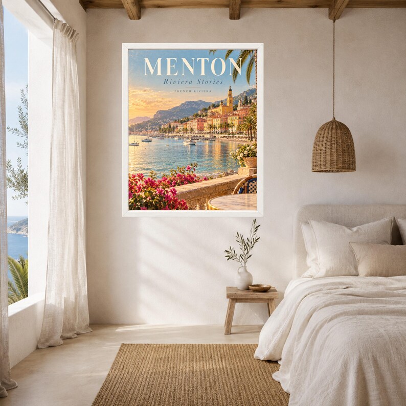May include: A framed wall art print featuring a coastal scene of Menton, France, with the text MENTON Riviera Stories. The image displays a sunlit harbor, colorful buildings, a stone wall, and vibrant pink bougainvillea flowers in the foreground.