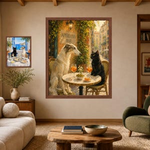 May include: A large framed wall art print depicting a white Borzoi dog and a black cat sitting at a round outdoor table with two orange cocktails and a bowl of olives, set in front of a building with a sign reading APERITIVO BAR.