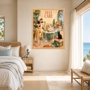 May include: A framed wall art print titled SELF CARE featuring a vintage-style illustration of a person in a towel reading a book while a skeleton relaxes in a bathtub nearby, accompanied by a black cat, all set in a Mediterranean bathroom.