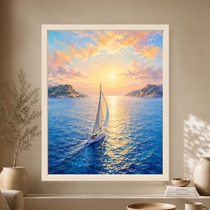Framed Mediterranean sailboat wall art showing a white sailing boat crossing vivid blue water toward a glowing golden sunset between two rocky island coastlines beneath soft pastel clouds.