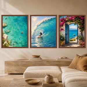 May include: A set of three framed wall art prints. The left print shows an aerial view of turquoise water with swimmers. The center print depicts a surfer riding a large blue wave. The right print features a blue door framed by pink flowers.