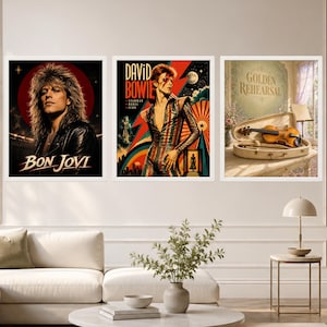 May include: Three framed wall art prints. The left print features a portrait of Bon Jovi with the text "BON JOVI". The center print shows a stylized David Bowie with the text "DAVID BOWIE", "STARMAN", "REBEL", and "ICON". The right print depicts a violin in a case with the text "GOLDEN REHEARSAL".
