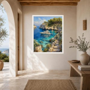 May include: A framed wall art print depicting a white yacht anchored in a clear blue Mediterranean cove. The scene features rocky cliffs, lush green trees, and a stone path leading toward the water under a bright blue sky with soft white clouds.