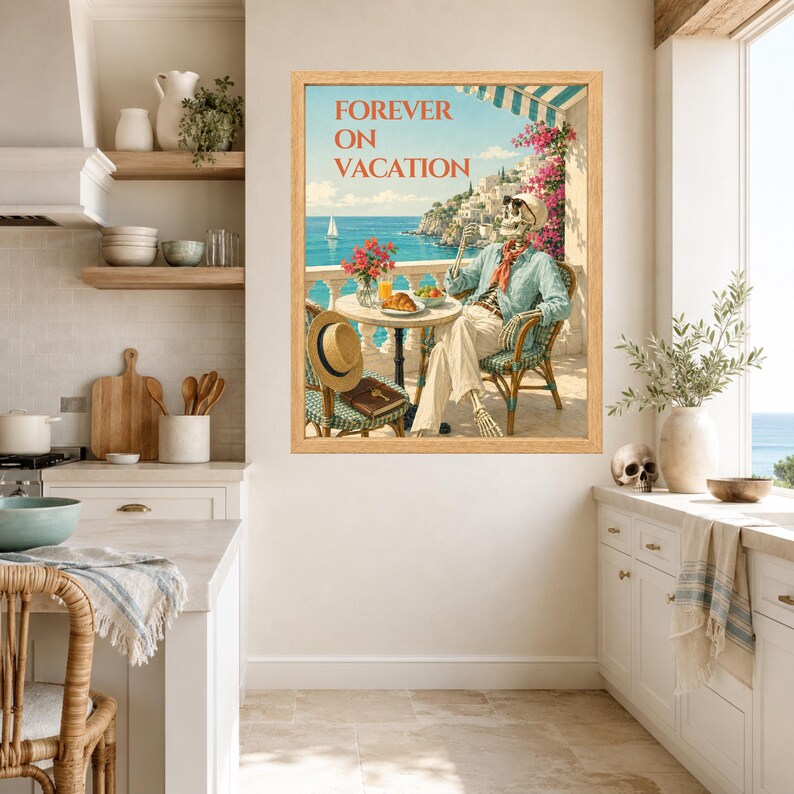 May include: A framed wall art print titled FOREVER ON VACATION featuring a skeleton wearing sunglasses and a light blue shirt, sitting at a table on a balcony overlooking the sea with a croissant, orange juice, and a straw hat nearby.