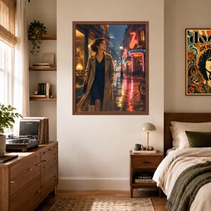 May include: A framed wall art print depicting a person in a tan trench coat walking down a rain-slicked city street at night, illuminated by glowing neon signs including a saxophone shape, set against a backdrop of urban architecture and lights.