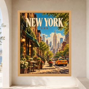 May include: A framed vertical wall art print featuring a New York City street scene with the text NEW YORK USA at the top. The image displays a sidewalk cafe with outdoor seating, lush green foliage, a yellow taxi cab, and skyscrapers.