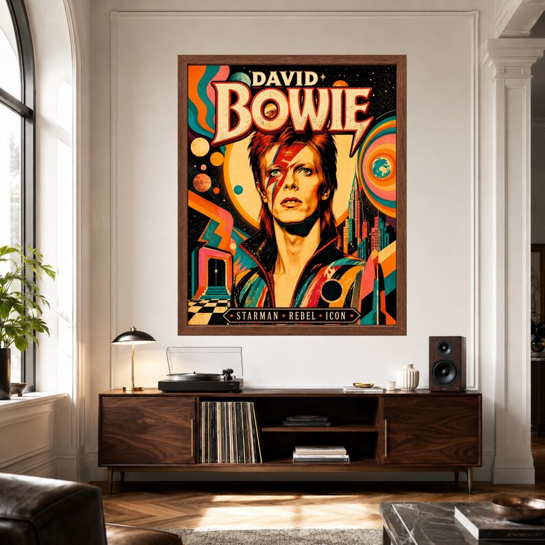 May include: A framed wall poster featuring a stylized portrait of David Bowie with a red lightning bolt across the face. The artwork includes vibrant orange, blue, and yellow cosmic patterns, a city skyline, and the text David Bowie Starman Rebel Icon.