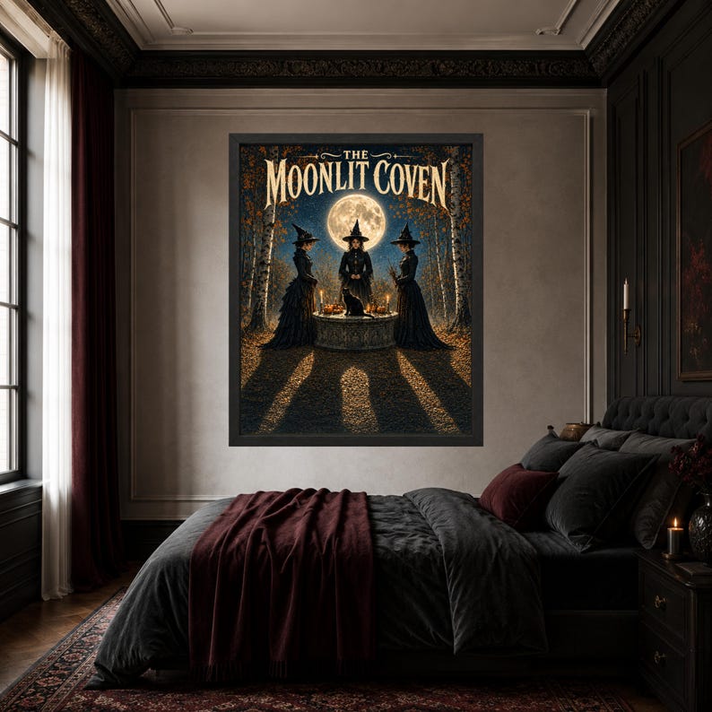 May include: A framed wall art print titled The Moonlit Coven featuring three figures in black robes and pointed hats standing around a stone table with a black cat under a full moon in a forest setting with autumn trees and long shadows.
